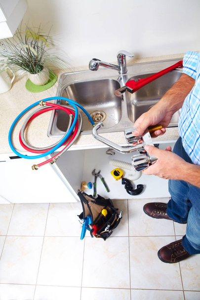 Plumbing tools on the kitchen. - Zdjęcie, obraz