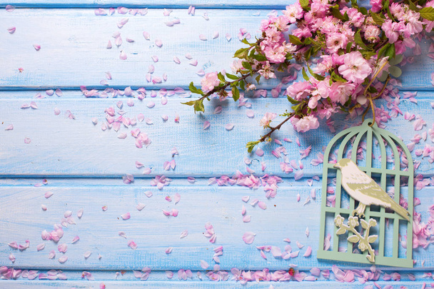 pink flowers on blue wooden planks.  - Фото, изображение