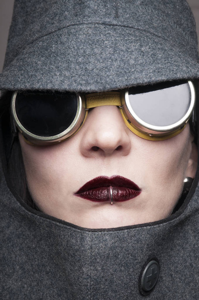 beauty woman portrait in forage cap and vintage aviator's glasses - Photo, Image