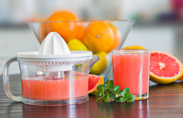 Glass of freshly squeezed grapefruit juice - Photo, Image