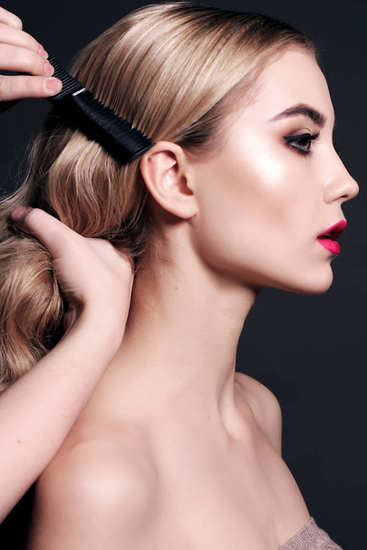 gorgeous young woman with blond hair, making make up - Fotoğraf, Görsel