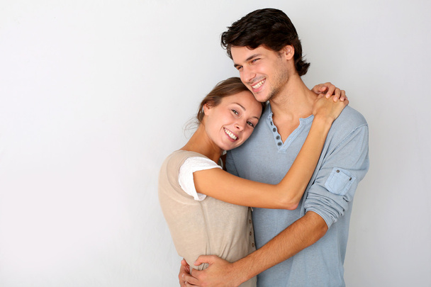 Cheerful young couple standing on white background, isolated - Photo, image