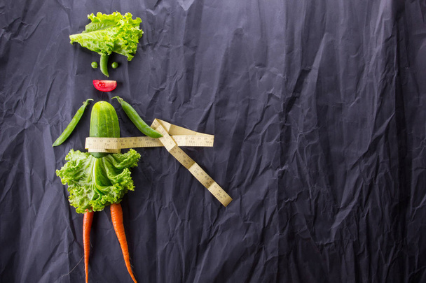 Healthy eating. Funny little woman made of the vegetables. With space for text. - Фото, изображение