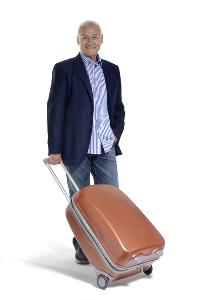 Senior man holding a luggage on white background - Foto, Bild
