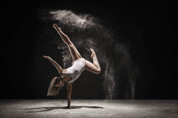 Graceful blonde dancing in white dust color - Photo, image