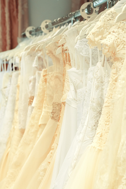 White and cream-colored wedding dresses vertical - Foto, imagen