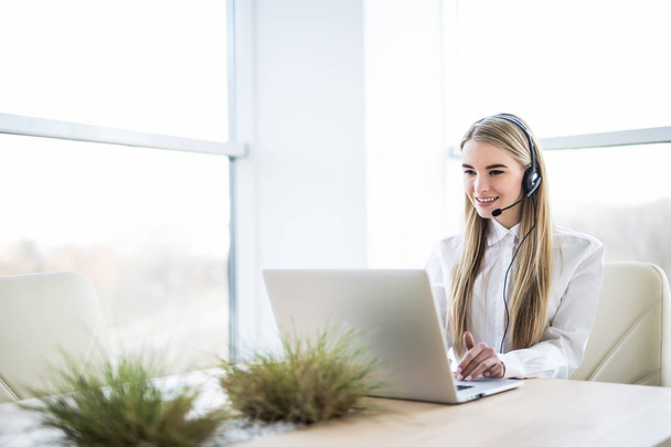 Woman customer support operator with headset and smiling - Photo, Image