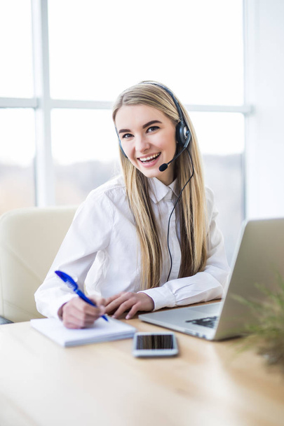 picture of smiling female helpline operator with headphones - Photo, Image