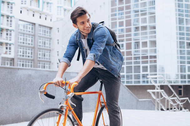 Man riding a bicycle outside - Photo, Image