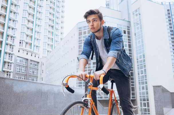 Man riding a bicycle outside - Фото, изображение