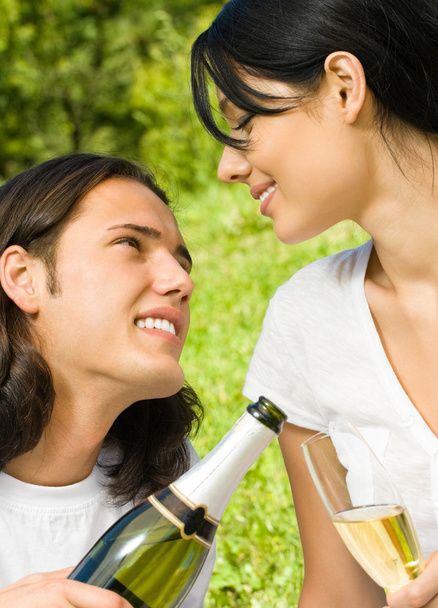 Young happy couple with champagne, outdoor - Foto, Imagem