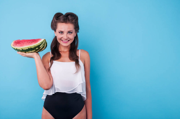 Picture of young woman holding a big slice watermelon - Фото, изображение