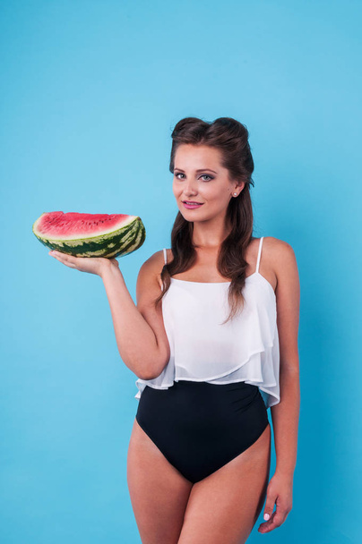 Picture of young woman holding a big slice watermelon - Foto, imagen
