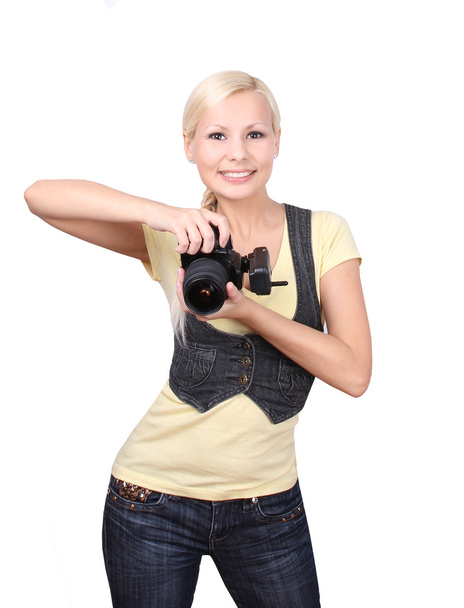 Young girl with camera smiling isolated on white - Fotó, kép