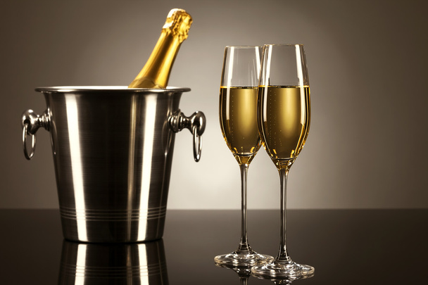 Two glasses of champagne with a champagne bottle in a bucket - Fotoğraf, Görsel