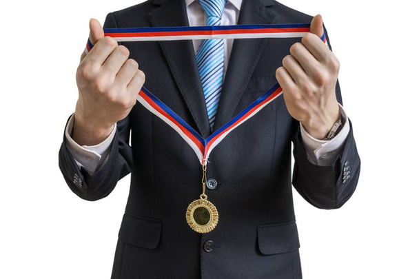 Man in suit is giving medal. Isolated on white background. - Foto, imagen