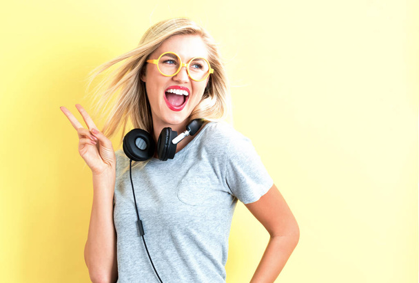 Happy young woman with headphones  - Fotoğraf, Görsel