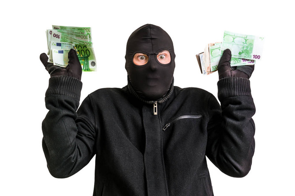 Zatrzymany złodziej w Kominiarki z skradzione pieniądze i podniesionymi rękami - Zdjęcie, obraz