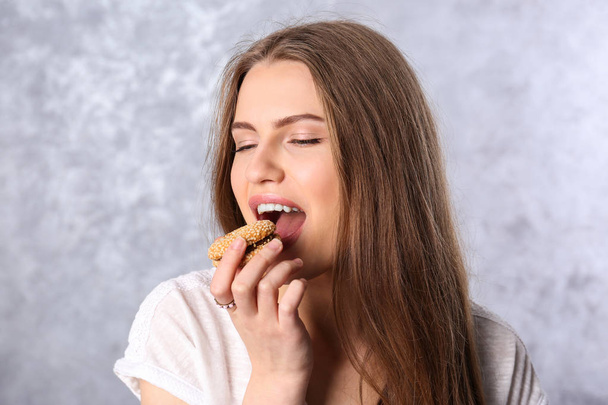 Young woman with cookie - Photo, Image
