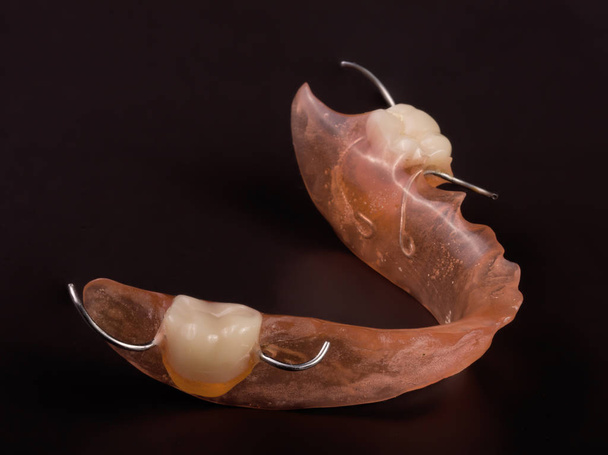 removable partial denture on a dark background - Photo, Image