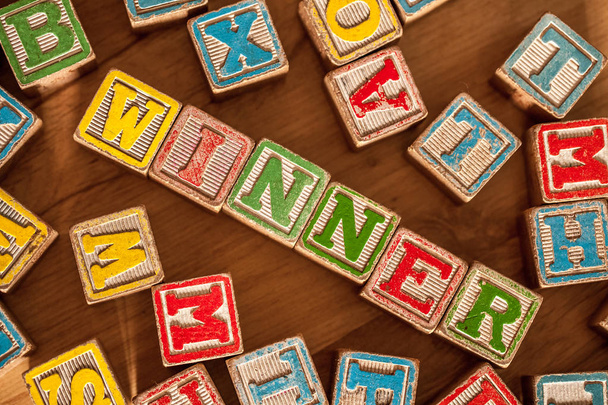 Wooden Toy Blocks Spell Winner - Photo, Image