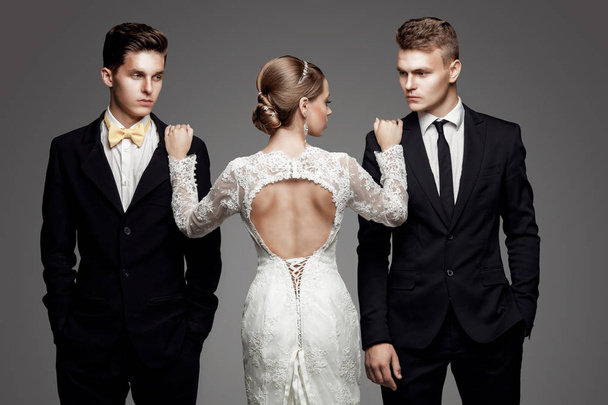 Two handsome men and beautiful bride, studio - Fotografie, Obrázek