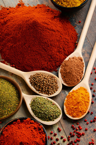 Variety of spices on kitchen table - Valokuva, kuva