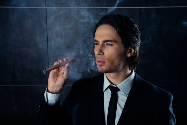 Portrait of brutal young man think with cigar - Foto, Bild