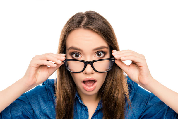 Wow! Surprised pretty young brunette touching glasses - Фото, изображение