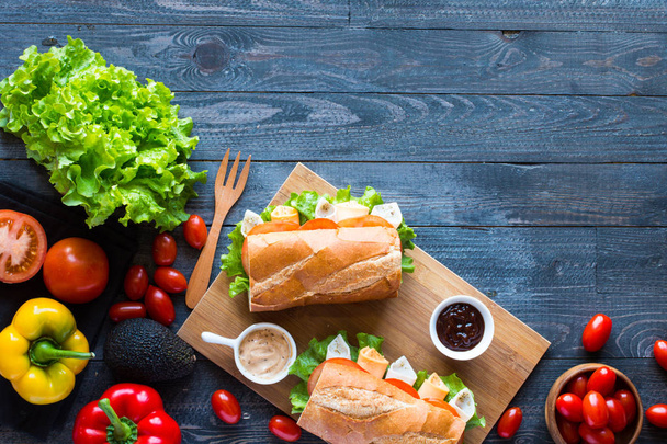 Delicious and Tasty sandwiches with turkey, ham, cheese, tomatoe - Fotografie, Obrázek
