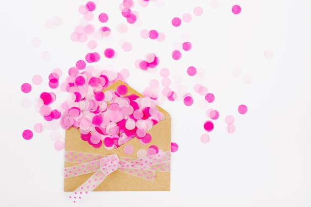 Pink paper confetti fly out enoverta, holiday concept - Фото, зображення