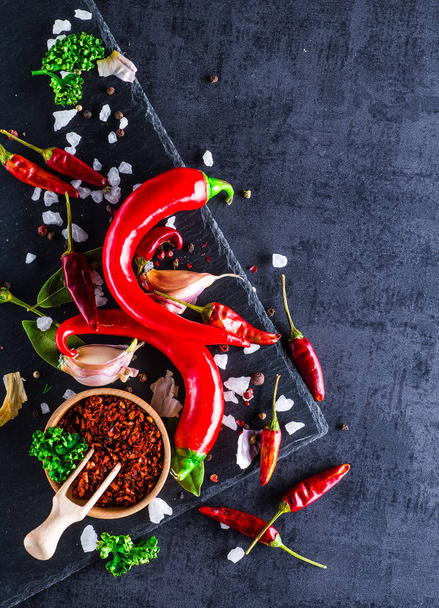 Chili peppers on a black background - Fotoğraf, Görsel