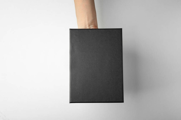 Female hand with black box - Fotografie, Obrázek