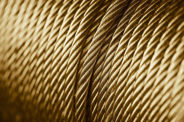 Cor de ouro limpar fio de aço novo cabo de aço ou corda de aço, tambor de funda de corda
. - Foto, Imagem