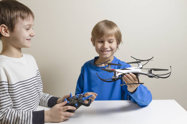Happy kids with drone at home. Technology, education, leisure, toys concept - Fotó, kép