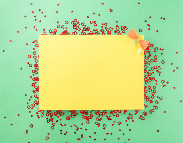Blank yellow paper with small red hearts - Fotoğraf, Görsel