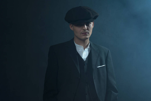 Gangster in flat cap in smoky room.  - Photo, Image