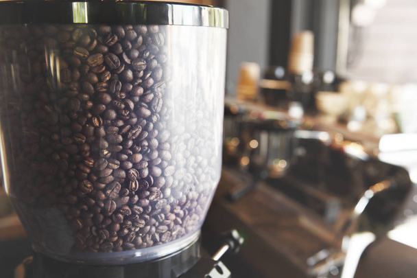 Coffee beans in coffee grinder - 写真・画像