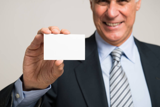 Businessman showing business card - Photo, image