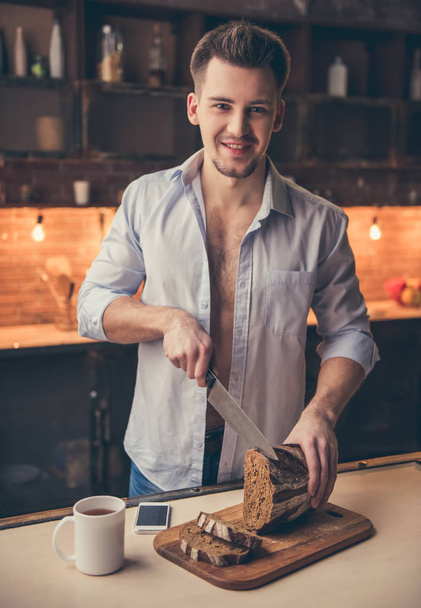 Sexy guy in the kitchen - Photo, image