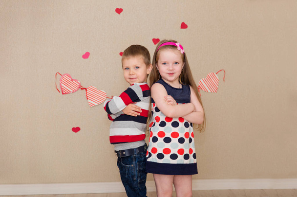 Beautiful boy and girl on the background of hearts - Fotoğraf, Görsel