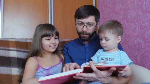 Dad Reading a Children's Book To His Children - Footage, Video