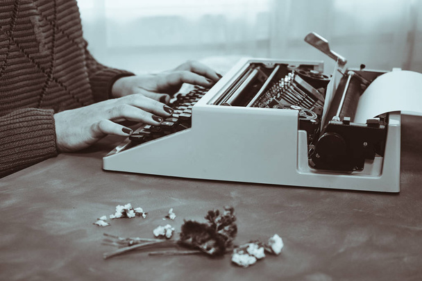 Girls hands typing in vintage typewriter - Photo, Image