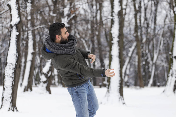 A man throwing a snowball - Photo, Image