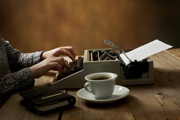 Woman is writing on old typewriter. - Fotoğraf, Görsel