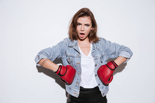 Beautiful woman boxer over white background - 写真・画像