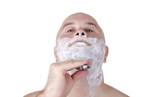Man shaving his beard - 写真・画像