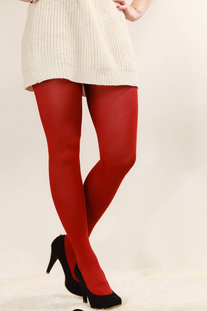 woman legs in red vivid color pantyhose black high heels shoes - Foto, Imagem