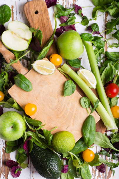 Variety of fresh vegetables and fruits on a wooden table - Foto, immagini