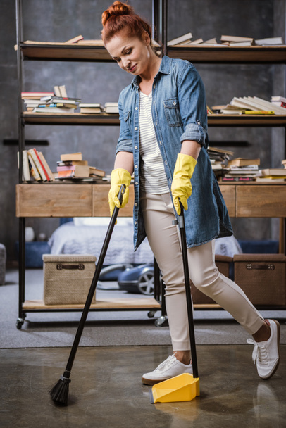 Woman sweeping floor   - Фото, зображення